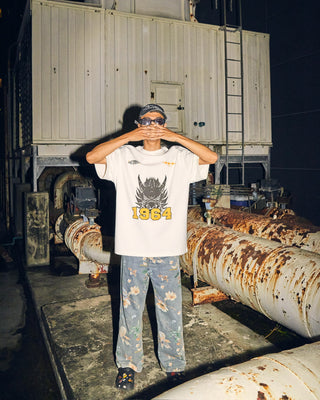 Petch in the 1964 dragon tee